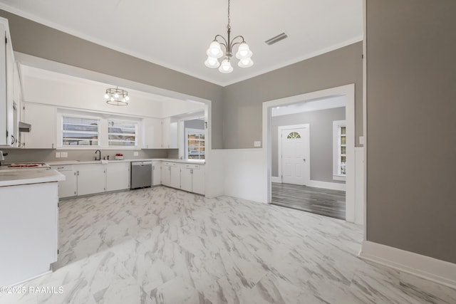 1323 Tarleton, Jeanerette, LA 70544 - kitchen featuring a chandelier, stainless steel dishwasher, a sink, light countertops, and ornamental molding
