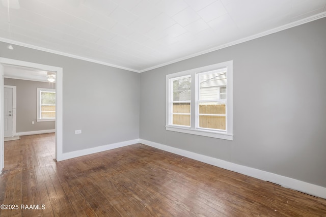 1323 Tarleton, Jeanerette, LA 70544 - unfurnished room featuring crown molding, dark wood-type flooring, baseboards, and a ceiling fan