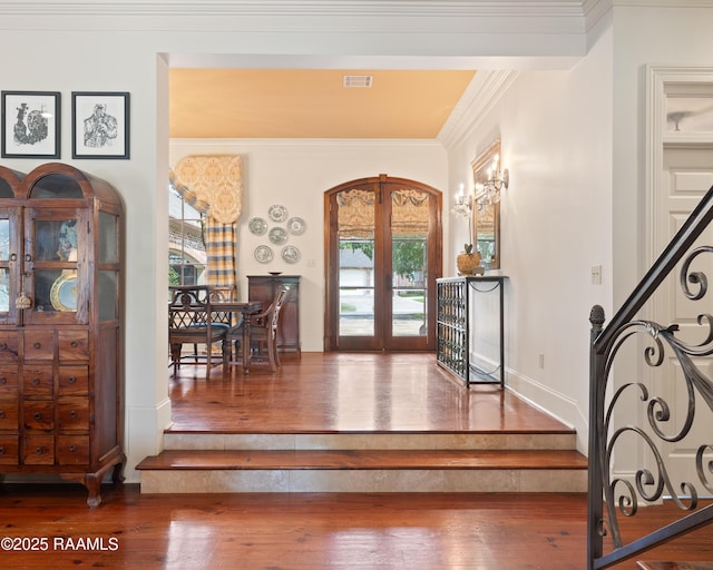 103 Masterspoint Dr, Broussard, LA 70518 - entrance foyer with french doors, wood-type flooring, ornamental molding, baseboards, and stairway