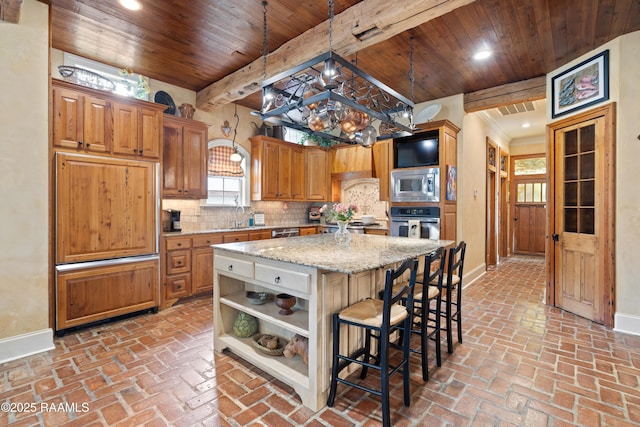 103 Masterspoint Dr, Broussard, LA 70518 - kitchen with appliances with stainless steel finishes, baseboards, open shelves, wood ceiling, and healthy amount of natural light