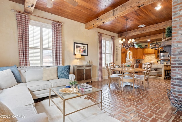 103 Masterspoint Dr, Broussard, LA 70518 - living area featuring plenty of natural light, wood ceiling with exposed beams, a chandelier, baseboards, and brick flooring