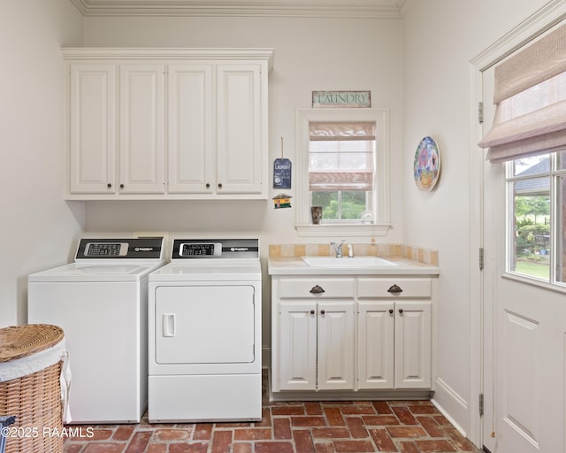103 Masterspoint Dr, Broussard, LA 70518 - washroom with cabinet space, brick floors, washing machine and clothes dryer, plenty of natural light, and ornamental molding