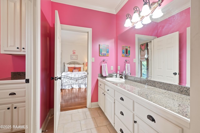 103 Masterspoint Dr, Broussard, LA 70518 - ensuite bathroom with vanity, crown molding, tile patterned flooring, baseboards, and a chandelier