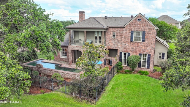 103 Masterspoint Dr, Broussard, LA 70518 - rear view of house featuring a balcony, a chimney, brick siding, and a patio area