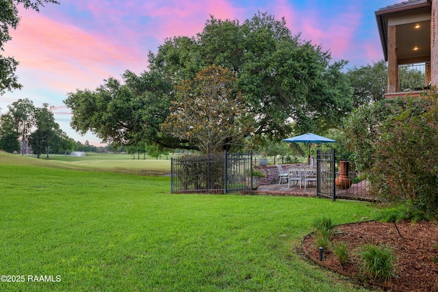 103 Masterspoint Dr, Broussard, LA 70518 - yard at dusk with a yard and a patio area