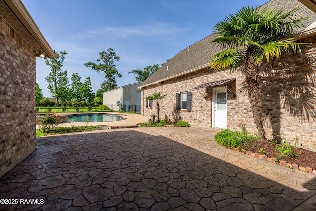 40400 Abby James Rd, Prairieville, LA 70769 - view of patio / terrace with an outdoor pool