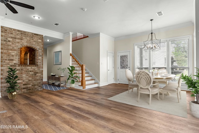 40400 Abby James Rd, Prairieville, LA 70769 - dining area featuring wood finished floors, stairway, baseboards, a chandelier, and ceiling fan