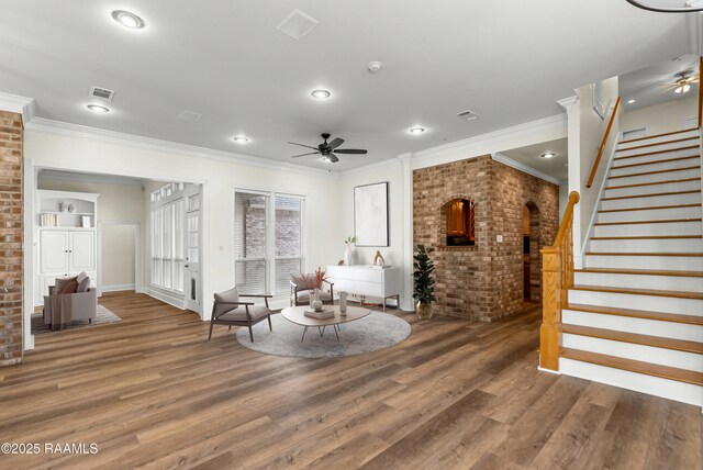 40400 Abby James Rd, Prairieville, LA 70769 - sitting room with ceiling fan, brick wall, wood finished floors, stairway, and crown molding