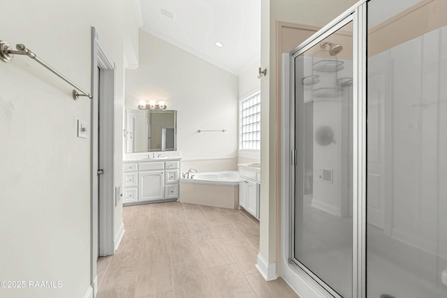 40400 Abby James Rd, Prairieville, LA 70769 - bathroom featuring ornamental molding, a shower stall, vanity, and a garden tub