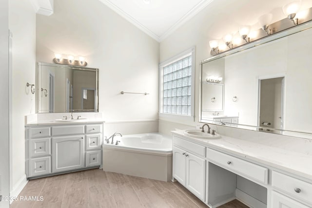 40400 Abby James Rd, Prairieville, LA 70769 - bathroom featuring ornamental molding, a garden tub, and two vanities