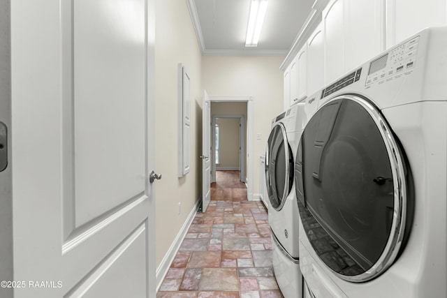 40400 Abby James Rd, Prairieville, LA 70769 - laundry area with washing machine and clothes dryer, cabinet space, ornamental molding, stone tile floors, and baseboards