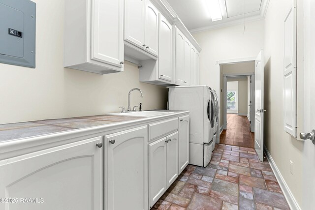 40400 Abby James Rd, Prairieville, LA 70769 - washroom with electric panel, cabinet space, attic access, crown molding, and baseboards