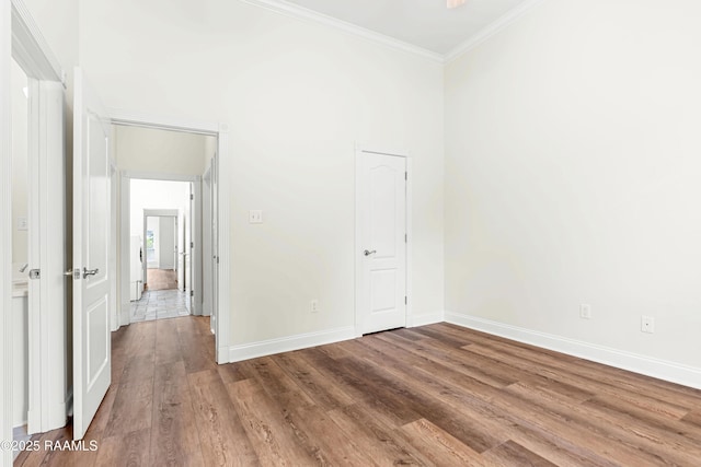 40400 Abby James Rd, Prairieville, LA 70769 - unfurnished bedroom featuring wood finished floors, ornamental molding, and baseboards