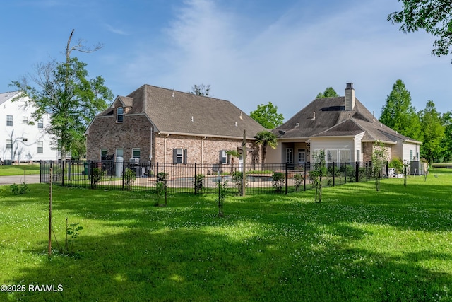 40400 Abby James Rd, Prairieville, LA 70769 - rear view of property with brick siding and a chimney