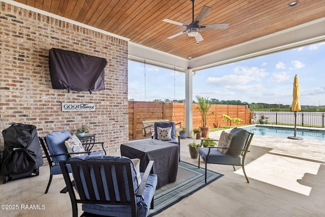 117 Big Lake Run, Youngsville, LA 70592 - fenced backyard with an outdoor living space, ceiling fan, and a patio