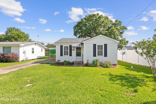 1617 Oscar St, Abbeville, LA 70510 - view of front facade with entry steps, driveway, and a carport