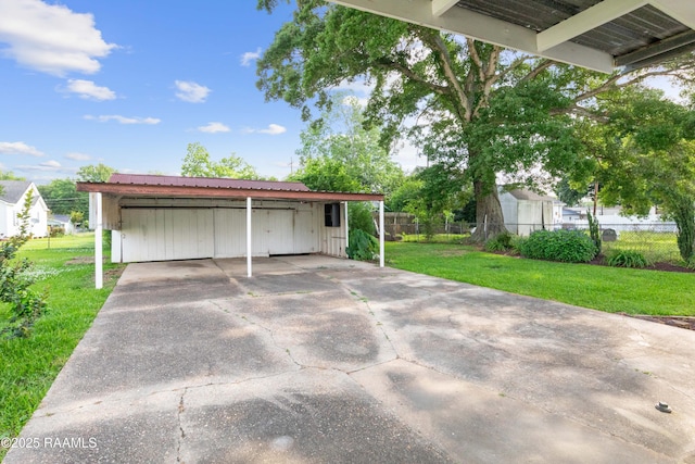 1617 Oscar St, Abbeville, LA 70510 - garage with a carport and concrete driveway