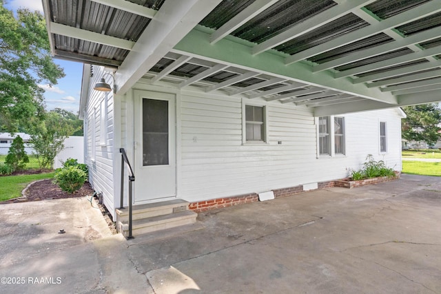 1617 Oscar St, Abbeville, LA 70510 - view of exterior entry with a patio and crawl space