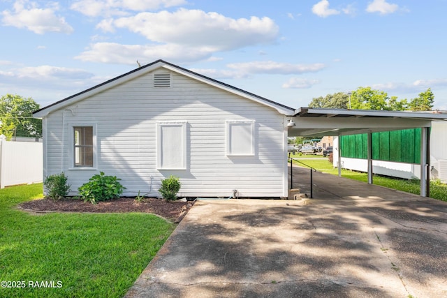 1617 Oscar St, Abbeville, LA 70510 - view of home's exterior with a carport and concrete driveway
