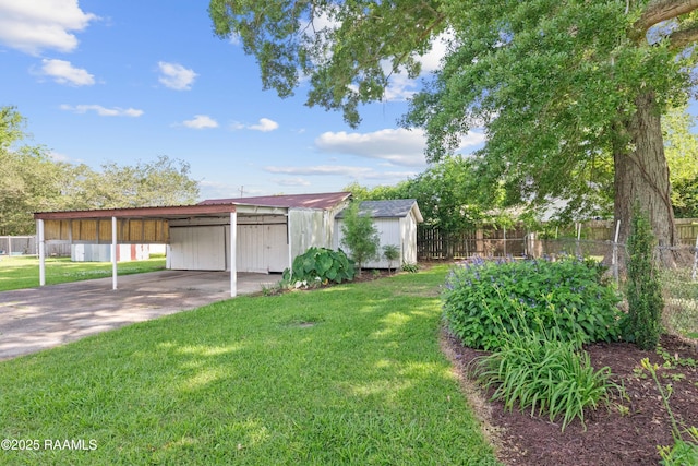 1617 Oscar St, Abbeville, LA 70510 - view of yard featuring concrete driveway and an attached carport