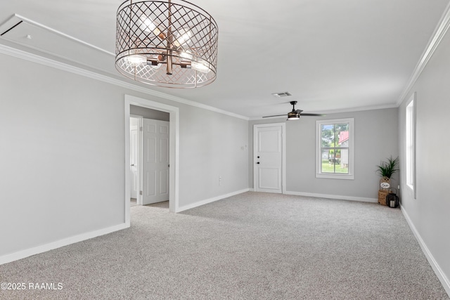 1617 Oscar St, Abbeville, LA 70510 - unfurnished room with carpet floors, crown molding, attic access, baseboards, and ceiling fan