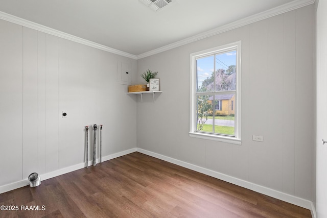 1617 Oscar St, Abbeville, LA 70510 - washroom with dark wood-style floors, plenty of natural light, electric dryer hookup, and crown molding