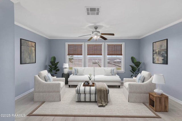 3785 Lake Breeze Rd, Lake Charles, LA 70605 - living room featuring healthy amount of natural light, ornamental molding, baseboards, and wood finished floors