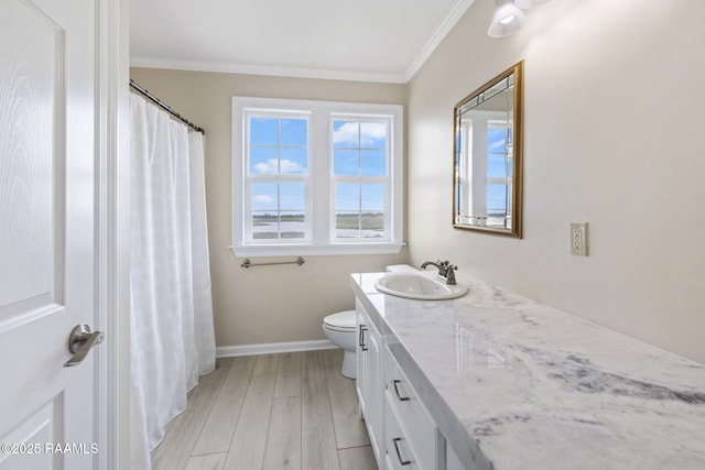 3785 Lake Breeze Rd, Lake Charles, LA 70605 - full bath with ornamental molding, vanity, wood finished floors, toilet, and baseboards