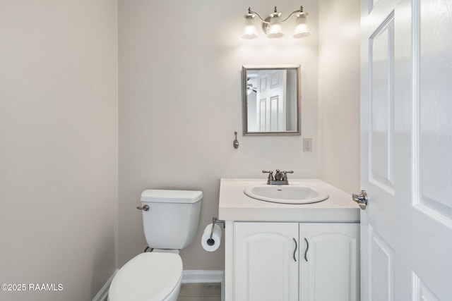 3785 Lake Breeze Rd, Lake Charles, LA 70605 - bathroom with toilet, vanity, and baseboards