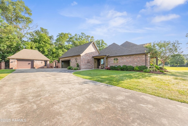 124 Edmund Ln, Eunice, LA 70535 - view of front of property featuring brick siding, a front yard, roof with shingles, and a garage