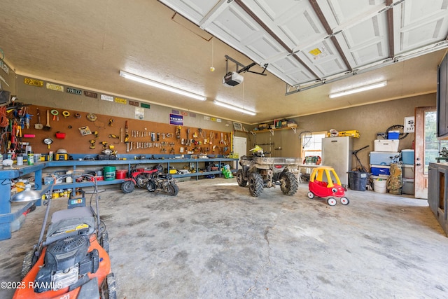 124 Edmund Ln, Eunice, LA 70535 - garage featuring a workshop area and a garage door opener
