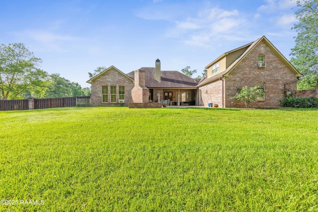124 Edmund Ln, Eunice, LA 70535 - back of property with brick siding and a chimney