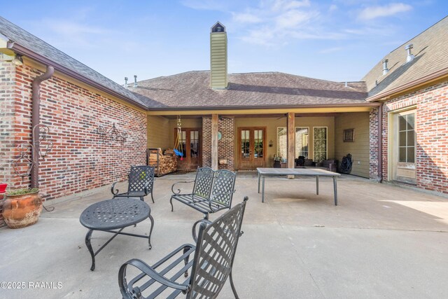 124 Edmund Ln, Eunice, LA 70535 - view of patio / terrace featuring french doors