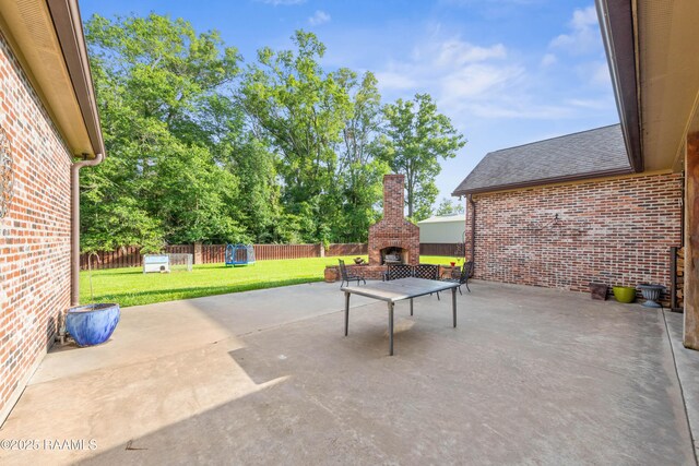 124 Edmund Ln, Eunice, LA 70535 - view of patio / terrace with a fireplace