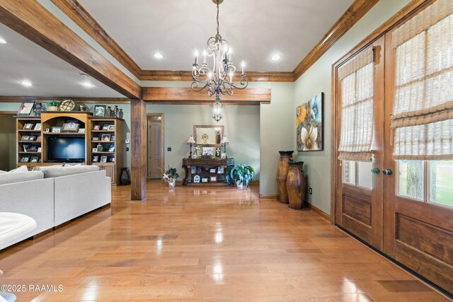 124 Edmund Ln, Eunice, LA 70535 - foyer entrance featuring crown molding, a chandelier, baseboards, light wood-style flooring, and recessed lighting