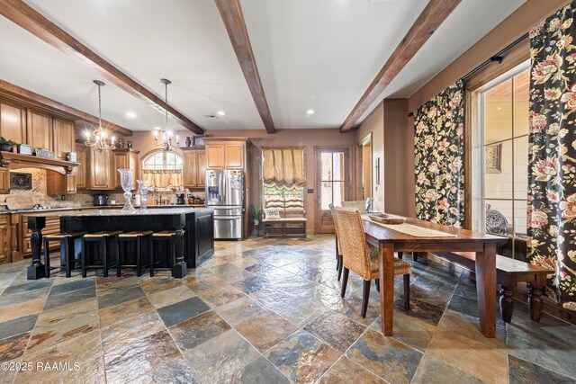 124 Edmund Ln, Eunice, LA 70535 - dining space featuring stone tile flooring, a chandelier, beam ceiling, and recessed lighting