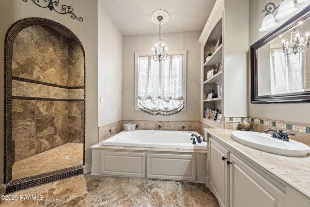124 Edmund Ln, Eunice, LA 70535 - full bath featuring a chandelier, a bath, vanity, and tiled shower