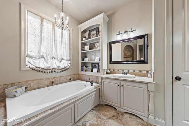 124 Edmund Ln, Eunice, LA 70535 - bathroom featuring vanity, a garden tub, and a chandelier