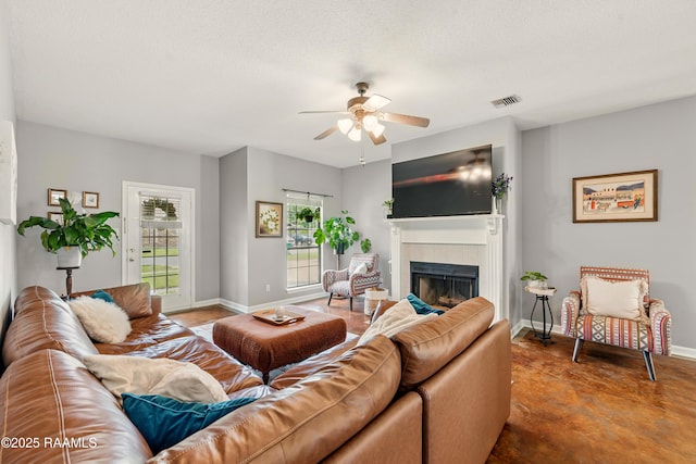 107 Westpointe Cir, Lafayette, LA 70506 - living area with ceiling fan, a fireplace, concrete floors, and baseboards