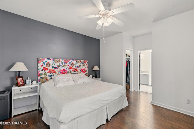 107 Westpointe Cir, Lafayette, LA 70506 - bedroom featuring a spacious closet, wood finished floors, a closet, a ceiling fan, and baseboards