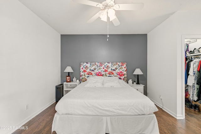 107 Westpointe Cir, Lafayette, LA 70506 - bedroom with a walk in closet, wood finished floors, and baseboards