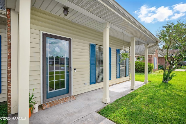 107 Westpointe Cir, Lafayette, LA 70506 - view of exterior entry featuring a porch and a lawn