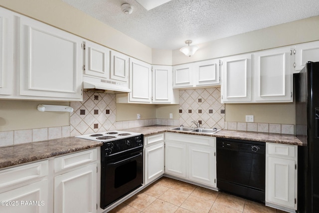 1314 Dulles Dr Unit F, Lafayette, LA 70506 - kitchen featuring black appliances, under cabinet range hood, a sink, white cabinetry, and a textured ceiling
