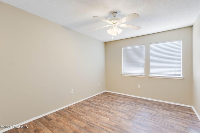 1314 Dulles Dr Unit F, Lafayette, LA 70506 - unfurnished room featuring light wood-type flooring, a ceiling fan, and baseboards