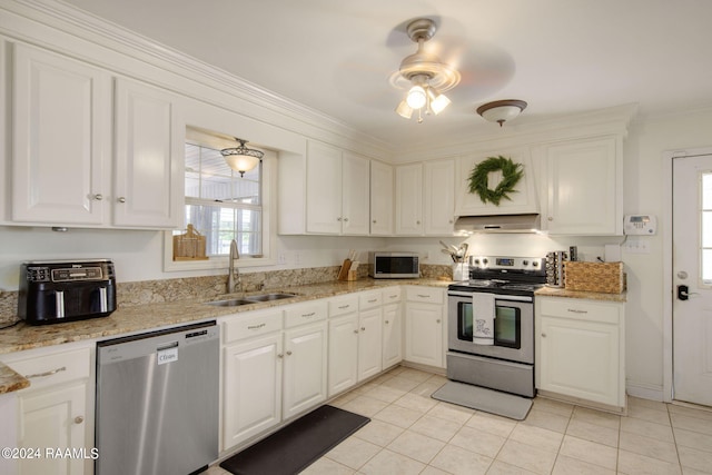 1012 Elsie Cir, Breaux Bridge, LA 70517 - kitchen with stainless steel appliances, under cabinet range hood, a sink, white cabinets, and light tile patterned floors
