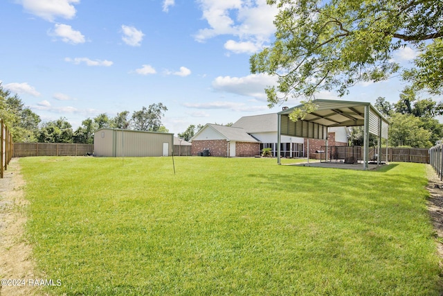 1012 Elsie Cir, Breaux Bridge, LA 70517 - view of yard featuring a carport and an outdoor structure