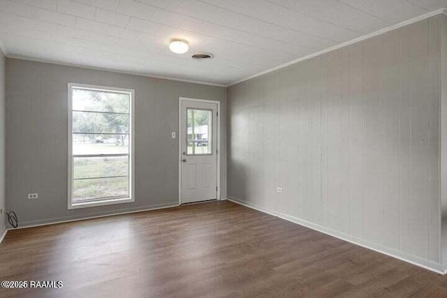650 Juanita St, Eunice, LA 70535 - foyer featuring dark wood-style flooring, crown molding, and baseboards