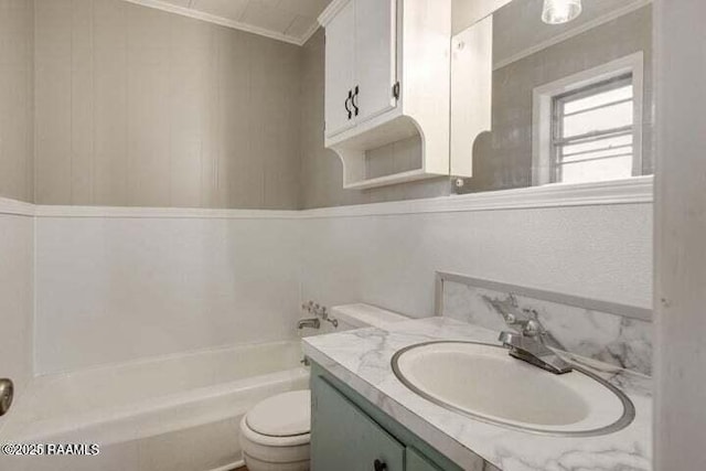 650 Juanita St, Eunice, LA 70535 - full bathroom featuring ornamental molding, vanity, toilet, and a tub to relax in