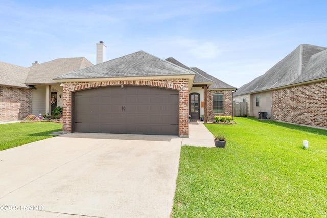 710 Highland View Dr, Youngsville, LA 70592 - french provincial home with brick siding, a garage, driveway, and a front yard