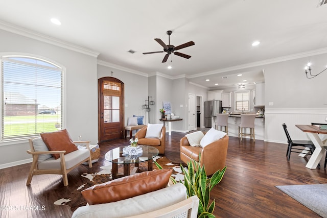 710 Highland View Dr, Youngsville, LA 70592 - living area with dark wood-style floors, a ceiling fan, recessed lighting, arched walkways, and ornamental molding